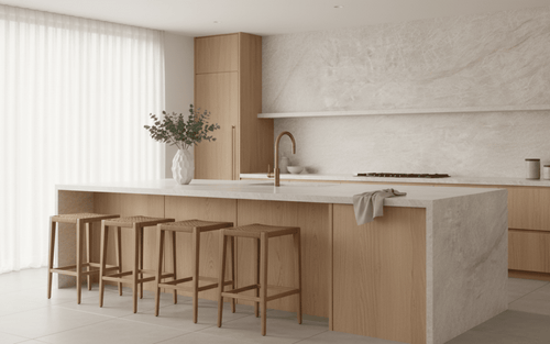 Modern kitchen featuring sintered stone benchtops, island benchtop and splashback with dining chairs and brass fixtures